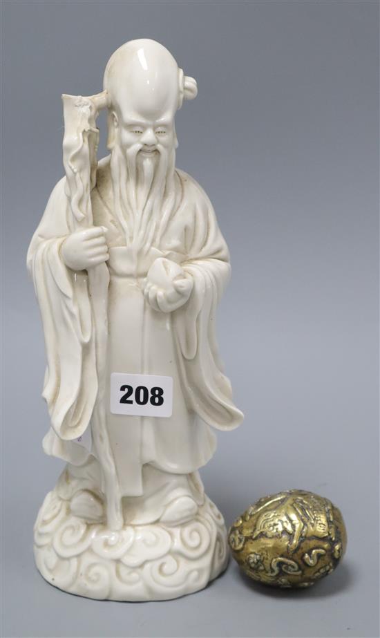 A Chinese 19th century blanc de chine deity, 28cm and a Chinese egg